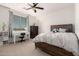 Inviting bedroom with a large bed, desk, dresser, and natural light from the window at 32525 N 41St Way, Cave Creek, AZ 85331
