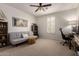Comfortable bedroom featuring a futon, desk, chair, and natural light from the window at 32525 N 41St Way, Cave Creek, AZ 85331
