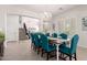 A bright dining room featuring a chandelier, wainscoting, and a formal table set for dinner at 32525 N 41St Way, Cave Creek, AZ 85331