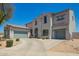 A charming two-story home with a three-car garage and desert landscaping at 32525 N 41St Way, Cave Creek, AZ 85331