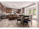 A spacious kitchen features wood cabinetry, granite counters, and a center island with pendant lighting at 32525 N 41St Way, Cave Creek, AZ 85331