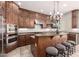 Gourmet kitchen featuring stainless steel appliances, granite countertops, and an island with seating at 32525 N 41St Way, Cave Creek, AZ 85331