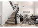 A nicely decorated living room and stairway with large windows providing natural light at 32525 N 41St Way, Cave Creek, AZ 85331