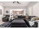 A large living room is open to the kitchen and features tile floors and comfortable, stylish furniture at 32525 N 41St Way, Cave Creek, AZ 85331