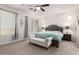 The primary bedroom features a neutral color scheme, carpeted floors, and a storage bench at the foot of the bed at 32525 N 41St Way, Cave Creek, AZ 85331
