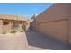 Stunning exterior showcases desert landscaping, a private gate, and a spacious two-car garage at 36601 N Mule Train Rd # 45B, Carefree, AZ 85377