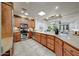 Bright kitchen with stone backsplash, countertops, stainless appliances, and tile flooring at 36601 N Mule Train Rd # 45B, Carefree, AZ 85377