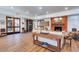 Inviting lobby with fireplace, wood floors, stylish decor and natural light creates a warm welcoming space at 36601 N Mule Train Rd # 45B, Carefree, AZ 85377