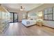 Spacious main bedroom with patio access, ceiling fan, ensuite bath, and beautiful views at 36601 N Mule Train Rd # 45B, Carefree, AZ 85377