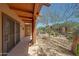 Covered patio with desert landscaping and native vegetation providing a natural buffer and peaceful outdoor area at 36601 N Mule Train Rd # 45B, Carefree, AZ 85377