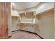 Walk-in closet offers wood floors, shelving, and ample storage space at 36601 N Mule Train Rd # 45B, Carefree, AZ 85377