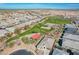 Wide aerial shot showcases the community amenities, including parks, pools, and recreational facilities at 38082 W Santa Barbara Ave, Maricopa, AZ 85138