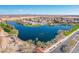 Overhead view showcasing the community's beautiful pond and well-maintained landscaping features at 38082 W Santa Barbara Ave, Maricopa, AZ 85138