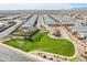 A beautiful aerial view showcases the community, with a green park and playground for residents to enjoy at 38082 W Santa Barbara Ave, Maricopa, AZ 85138