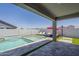 Beautiful backyard pool and spa with integrated water feature and patio area at 38082 W Santa Barbara Ave, Maricopa, AZ 85138