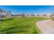Expansive community park featuring a playground and green spaces for leisure and outdoor activities at 38082 W Santa Barbara Ave, Maricopa, AZ 85138