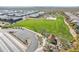 Aerial shot of the community park with green spaces, playgrounds, and shaded picnic areas at 38082 W Santa Barbara Ave, Maricopa, AZ 85138