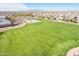 Extensive green space and playground offers recreation opportunities within the residential community at 38082 W Santa Barbara Ave, Maricopa, AZ 85138