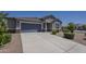 Charming single-story home with a two-car garage and well-manicured landscaping in a desirable community at 38082 W Santa Barbara Ave, Maricopa, AZ 85138