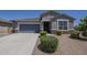Attractive single-story home with a well-kept front yard and a convenient two-car garage at 38082 W Santa Barbara Ave, Maricopa, AZ 85138