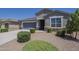 Charming single-Gathering home with well-maintained landscaping, showcasing a welcoming exterior at 38082 W Santa Barbara Ave, Maricopa, AZ 85138
