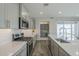 Well-equipped kitchen with stainless steel appliances, a center island, and subway tile backsplash at 38082 W Santa Barbara Ave, Maricopa, AZ 85138