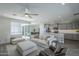 Open floor plan connects the living area and kitchen, featuring modern finishes and ample seating at 38082 W Santa Barbara Ave, Maricopa, AZ 85138