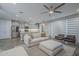 Open floor plan connects kitchen and living area, featuring modern finishes and ample natural light at 38082 W Santa Barbara Ave, Maricopa, AZ 85138