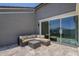 Cozy patio with outdoor seating, offering a relaxing space for entertaining and enjoying the backyard view at 38082 W Santa Barbara Ave, Maricopa, AZ 85138