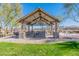 Picturesque park pavilion equipped with picnic benches, ideal for Gathering gatherings and outdoor dining at 38082 W Santa Barbara Ave, Maricopa, AZ 85138