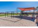 Neighborhood playground with swings, slide, and climbing structure, perfect for community recreation at 38082 W Santa Barbara Ave, Maricopa, AZ 85138
