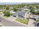 Aerial view of the property showcasing the house layout, solar panels, landscaping, and neighborhood setting at 3834 E Clarendon Ave, Phoenix, AZ 85018