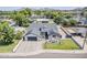 Aerial view highlighting the renovated home, landscaping, outdoor seating, and inviting curb appeal at 3834 E Clarendon Ave, Phoenix, AZ 85018