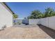Side yard showcasing the block fence and landscaping, leading to a secure backyard at 3834 E Clarendon Ave, Phoenix, AZ 85018