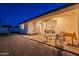 Beautiful backyard featuring a patio, outdoor seating, lounge chairs, and sliding glass doors to the home's interior at 3834 E Clarendon Ave, Phoenix, AZ 85018