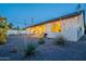 Well-maintained backyard with native plants, covered patio, and a grill for outdoor cooking at 3834 E Clarendon Ave, Phoenix, AZ 85018