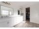 Bright bathroom features double sinks, vanity with ample storage, and a walk-in closet at 3834 E Clarendon Ave, Phoenix, AZ 85018