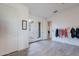 Bright bedroom with wood-look floors with French doors and doors leading to other rooms at 3834 E Clarendon Ave, Phoenix, AZ 85018