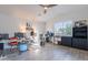 Spacious bedroom with wood-look floors, a ceiling fan, and a large window at 3834 E Clarendon Ave, Phoenix, AZ 85018