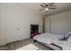 Bedroom featuring a ceiling fan, neutral paint and decor, and wood-look floors at 3834 E Clarendon Ave, Phoenix, AZ 85018