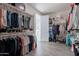 Spacious walk-in closet with built-in shelving and clothing racks at 3834 E Clarendon Ave, Phoenix, AZ 85018