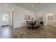 Cozy dining area with views of the front door and featuring a contemporary table and chairs at 3834 E Clarendon Ave, Phoenix, AZ 85018