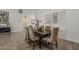 Contemporary dining room featuring a dark wood table, neutral chairs, and stylish wall art at 3834 E Clarendon Ave, Phoenix, AZ 85018