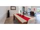 Dining room featuring modern artwork and flooring, next to the living room at 3834 E Clarendon Ave, Phoenix, AZ 85018