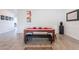Dining room featuring modern table and chairs, complemented by modern artwork and flooring at 3834 E Clarendon Ave, Phoenix, AZ 85018