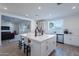 Open-concept kitchen with a large island, stainless steel appliances, and ample counter space at 3834 E Clarendon Ave, Phoenix, AZ 85018