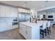 Spacious kitchen featuring a large island with seating, modern appliances, and white cabinetry at 3834 E Clarendon Ave, Phoenix, AZ 85018