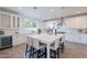 Spacious white kitchen with stainless steel appliances, an island, and lots of counter space at 3834 E Clarendon Ave, Phoenix, AZ 85018