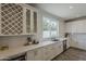 Kitchen with white cabinetry, stainless steel appliances, and an undermount sink with a view at 3834 E Clarendon Ave, Phoenix, AZ 85018