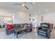 Open living room with tile floors, comfortable seating, and access to the kitchen area at 3834 E Clarendon Ave, Phoenix, AZ 85018